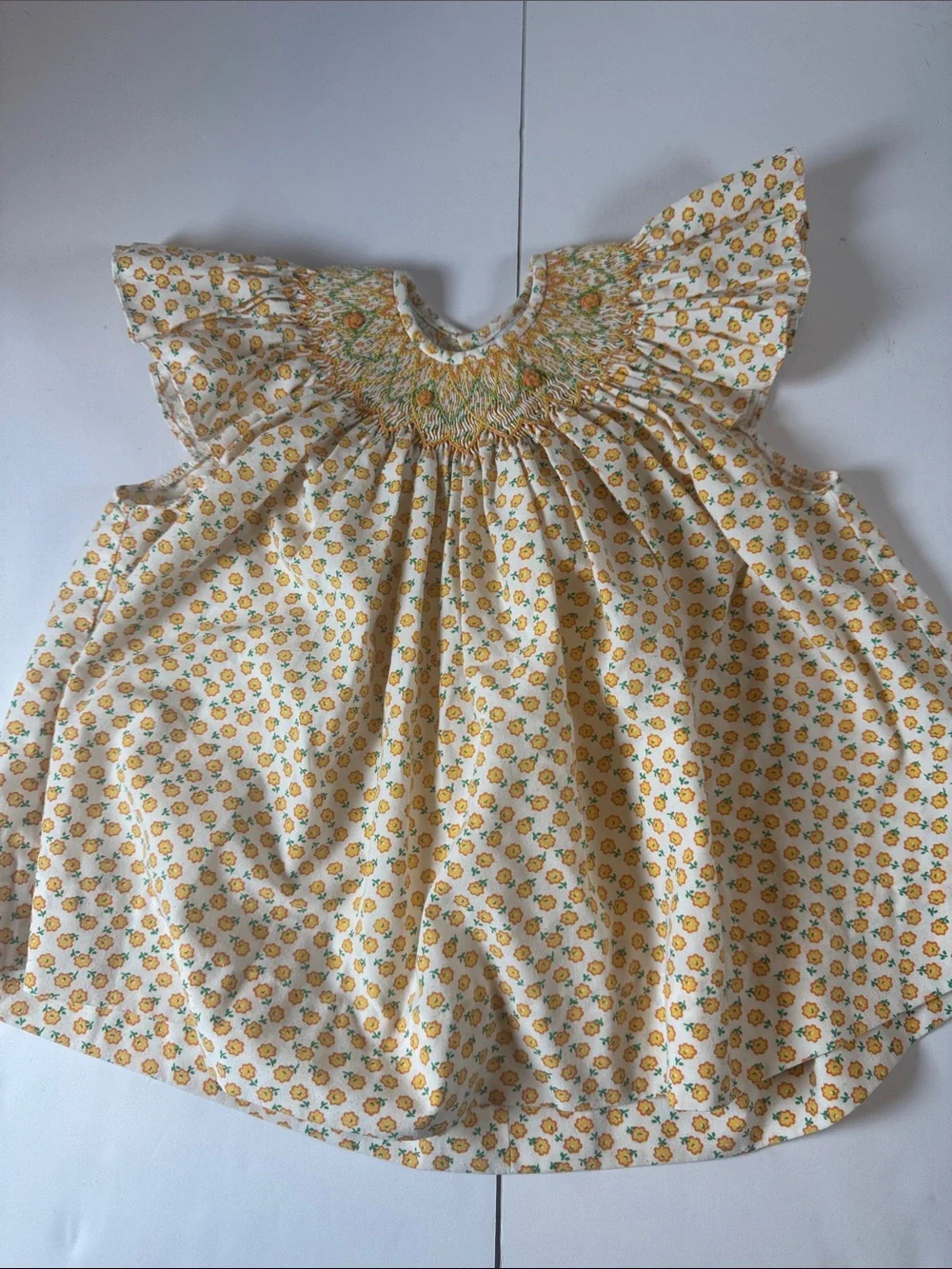 Remember hguyen White and Yellow Floral Smocked Flutter dress